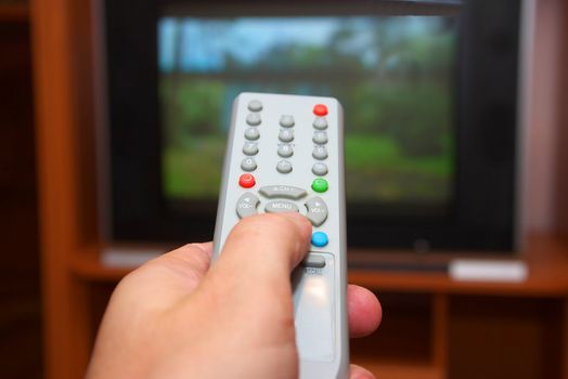 photo of the remote control switching channel on tv