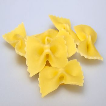 Italian farfalle (butterflies) over light gray background