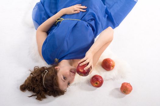 Lady in blue antique dress and red apples on white background
