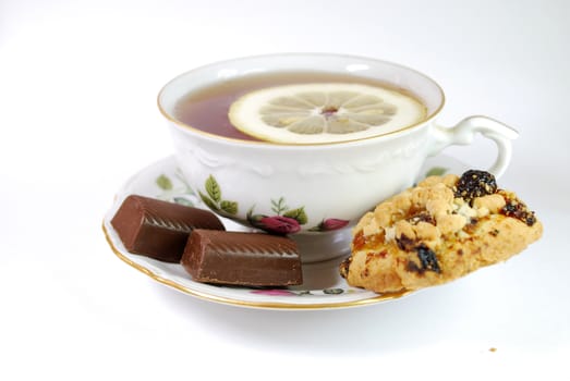 Isolated Cup of Tea with Sweet on White