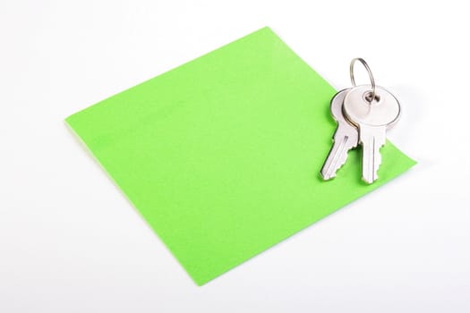Colour paper and two keys from office, apartments.