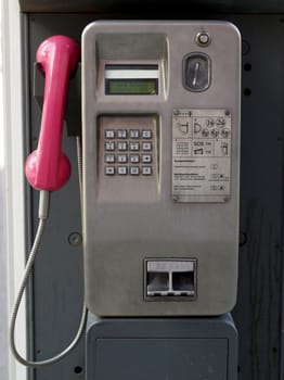 Detail of public phone in a telephone box