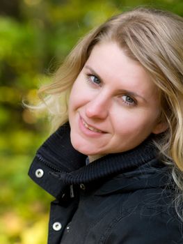 portrait of Beautiful romantic blonde in the autumn park 