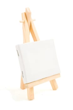 painting easel with empty canvas isolated on white