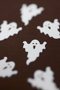 small plastic halloween ghosts pictured with a narrow depth of field