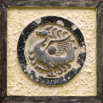 It is Chinese religious stone carving of peafowl.