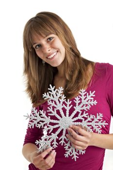 young woman holding a decorative snow flake