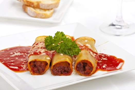 traditional cannelloni dish with tomato sauce