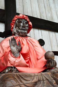 Binzuru (Pindola): wooden statue of Buddha at the entrance of Todai-ji temple in Nara, Japan.