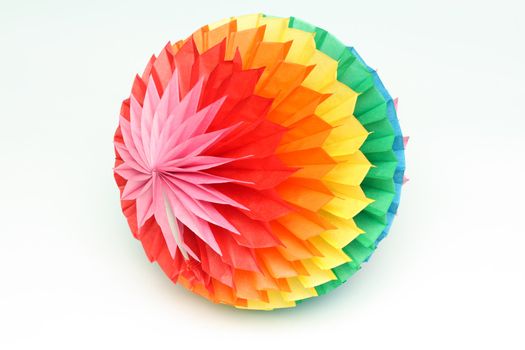 Bright children's toy - a colour paper sphere