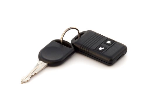 Car key and alarm system charm, close up on a white background.