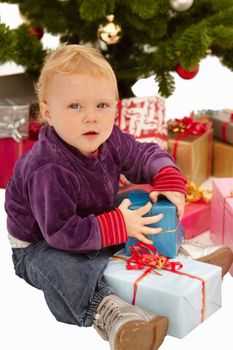 Christmas - Child caught opening x-mas gifts under tree