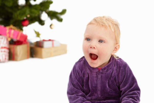Surprise - Cute child at christmas time on white