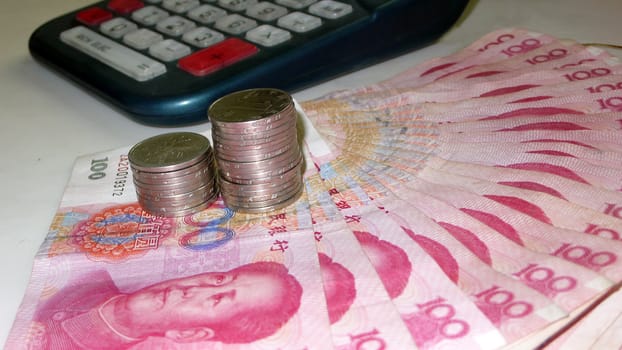 currency，money，renminbi，bill，chinese，yuan，cash，china，wealth，RMB，change，financial，hundred，Monetary，coin，calculator，