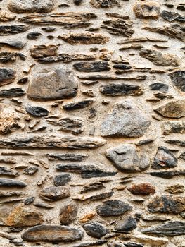 Texture rich stones of a house wall