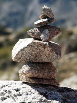 Pile of stones indicating a trail in the mountains