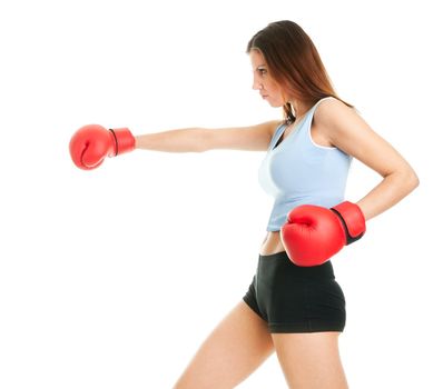 Beautiful woman practicing boxing. Isolated on white