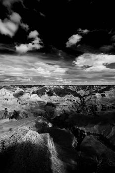 Light and shadow playing on texture of the Grand Canyon featuring Bright Angel Trail