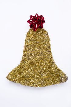 christmas gold bell with decorative ribbon on white background