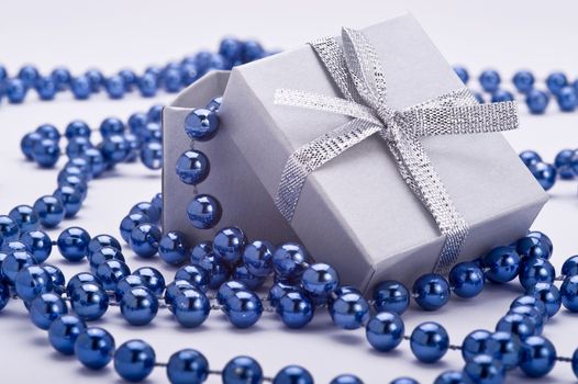christmas gift with blue decoration on white background