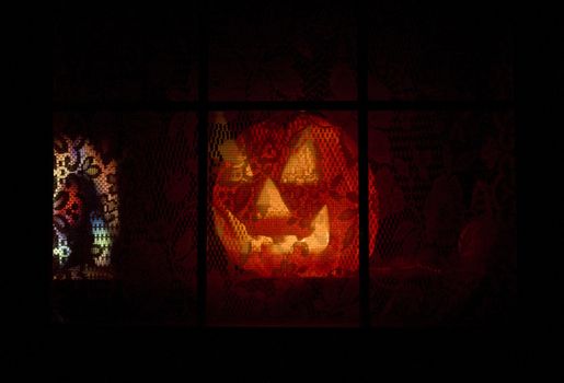 pumpkin behind a window, Halloween in Machias, Maine, USA
