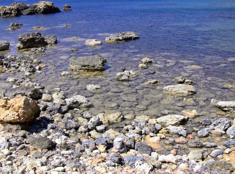 Typical rocky coastline in Malta, punctuated with sheer drops and jagged cliffs