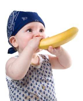 baby eating a banana.child keeps banana