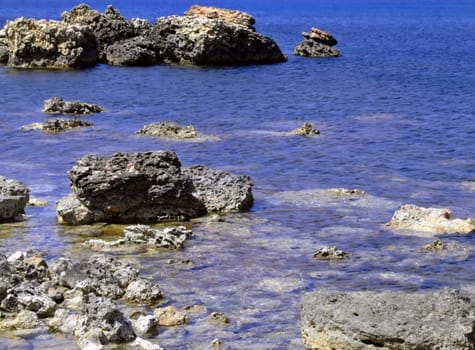 Typical rocky coastline in Malta, punctuated with sheer drops and jagged cliffs