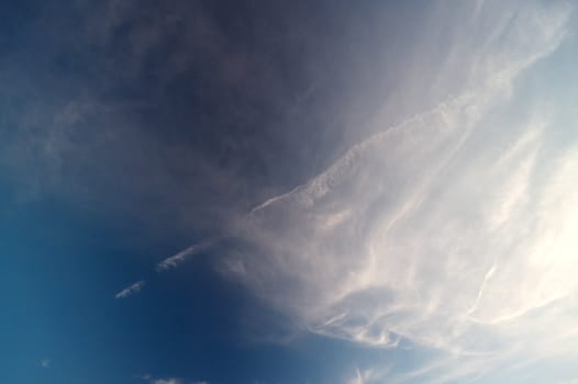 Interesting clouds on blue sky