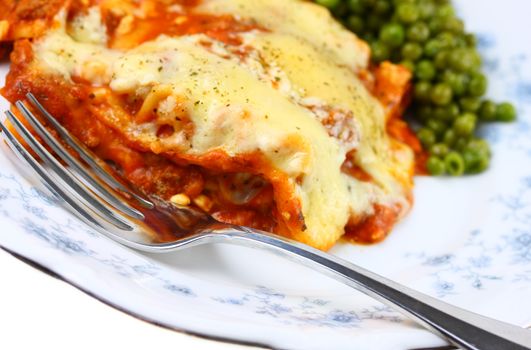 Lasagna and green peas.