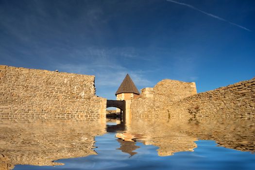 Chapel and walls on Medvedgrad castle with reflection in water