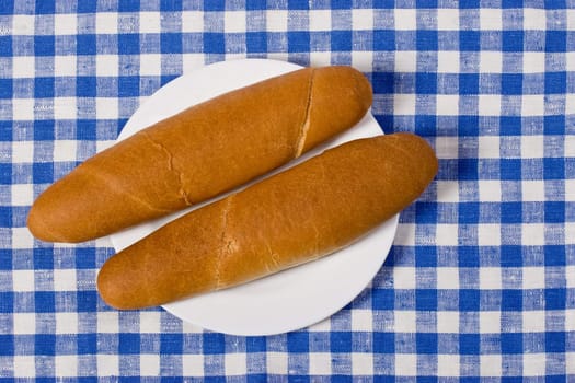 Slaced French bread, two bun on the plate