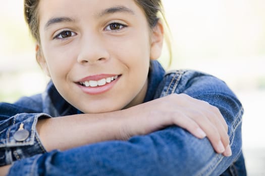 Portrait of Smiling Hispanic Teen Girl With Folded Arms