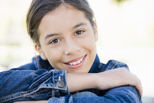 Portrait of Smiling Hispanic Teenage Girl With Folded Arms