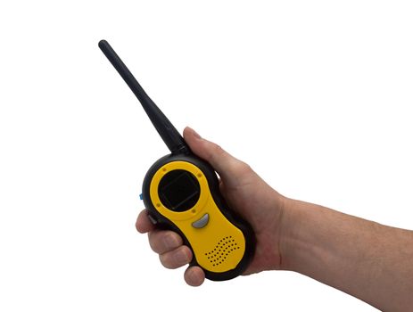 an isolated over white caucasian man's hand holding and pressing a button on a walkie talkie / 2 way radio.