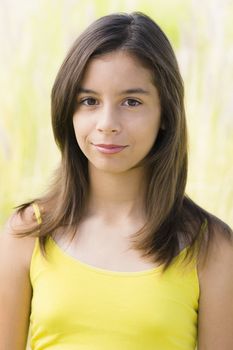 Hispanic Teenage Girl Smiling Directly To Camera