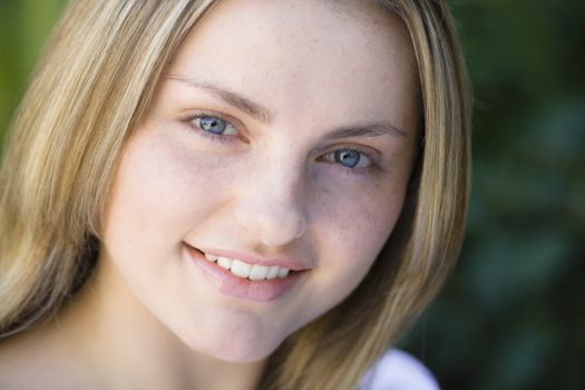 Closeup Portrait of a Smiling Pretty Blond Teen Girl