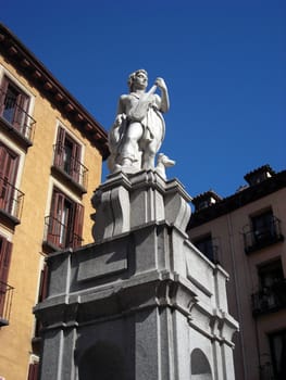           Statue of a violin player in a small square close to Plaza Mayor in the very center of Madrid