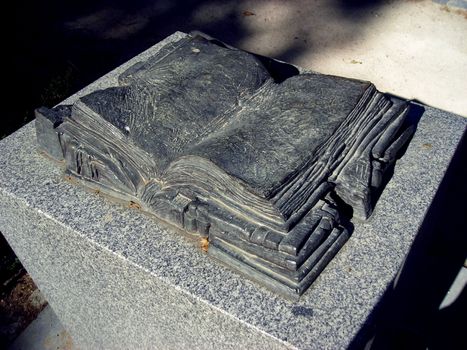 Black stone book located in the Retiro Gardens in Madrid.