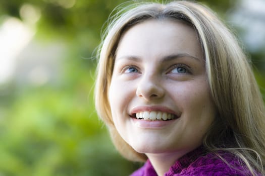 Closeup Portrait of a Smiling Pretty Blond Teen Girl