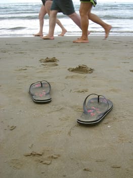           My flip-flop shoes left in the sand between the swimmers while i was having a swim.