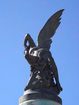 Bottom view of the only one statue in the world dedicated to the devil, located in the Retiro Gardens in Madrid.