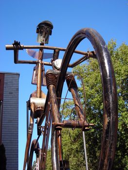 View of a mechanical sculpture of a cyclist in a street of Madrid
