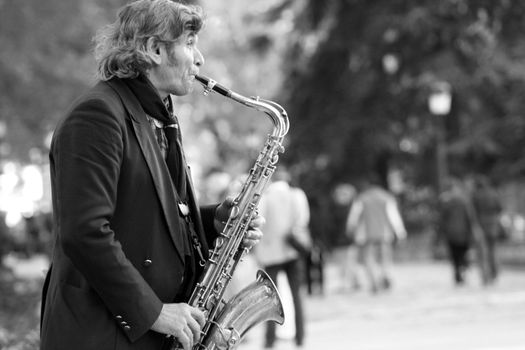 Portrait of a sax player in front of the Prado Museum in Madrid.