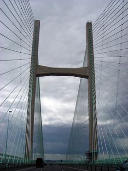 View from a car of the Severn Bridge on a stormy day.