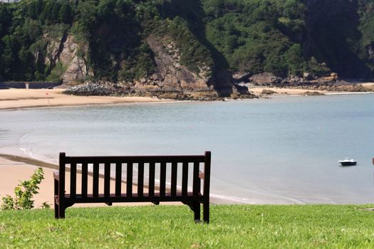 North Beach of Tenby, Wales, viewed from a bench on a hill.