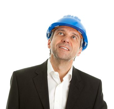 Portrait of successfull architect wearing blue hard hat and looking up. Isolated on white