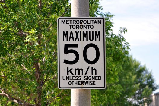 Traffic sign indicating speed limit in the city of Toronto, Canada.