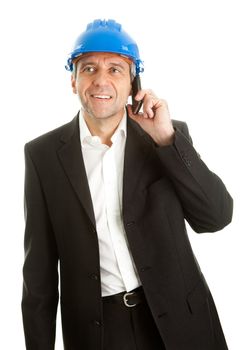 Portrait of architect wearing blue hard hat and talking on mobile phone. Isolated on white