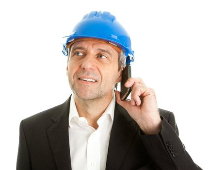 Portrait of architect wearing blue hard hat and talking on mobile phone. Isolated on white